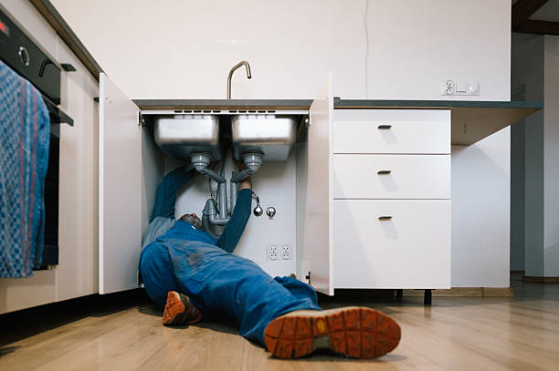Professional Emergency Plumber technician working in Roosevelt, NY